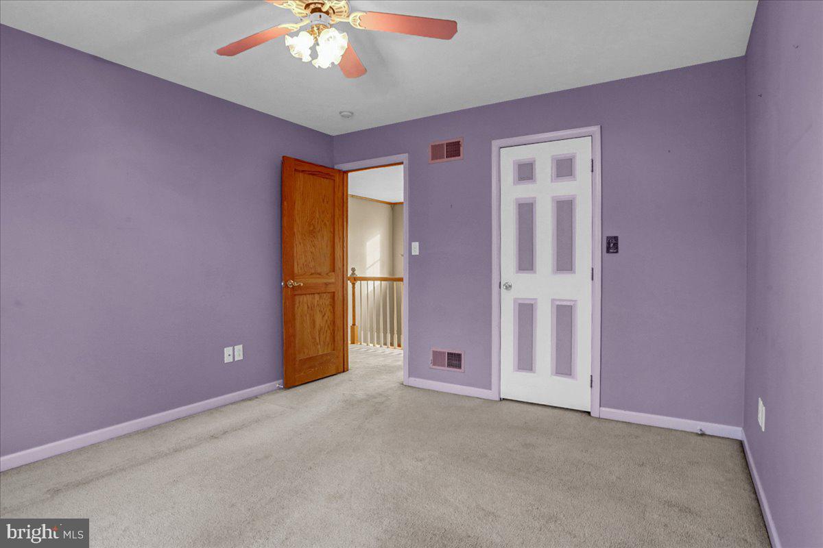 123 Mexico Road Oley, PA 19547 - Photo 22 of 41 a view of an empty room with a chandelier fan