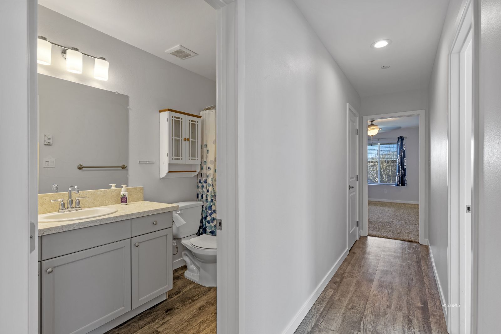 1200 South McCall Street Ridgecrest, CA 93555 - Photo 22 of 30 a bathroom with a sink a toilet a shower and a mirror