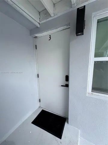 a kitchen with stainless steel appliances granite countertop a sink and a refrigerator