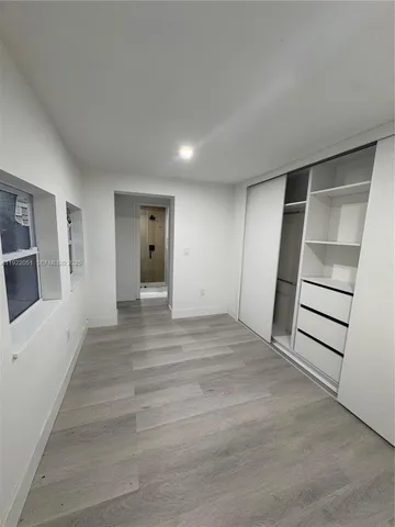 a bathroom with a granite countertop shower and a toilet