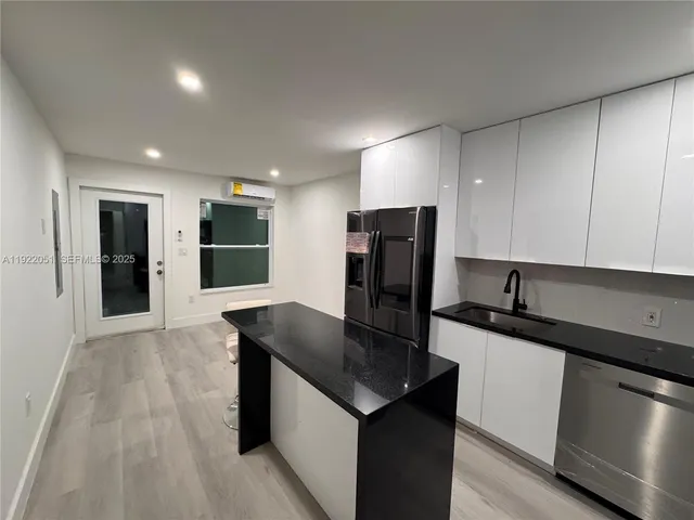 a kitchen with a sink and a stove