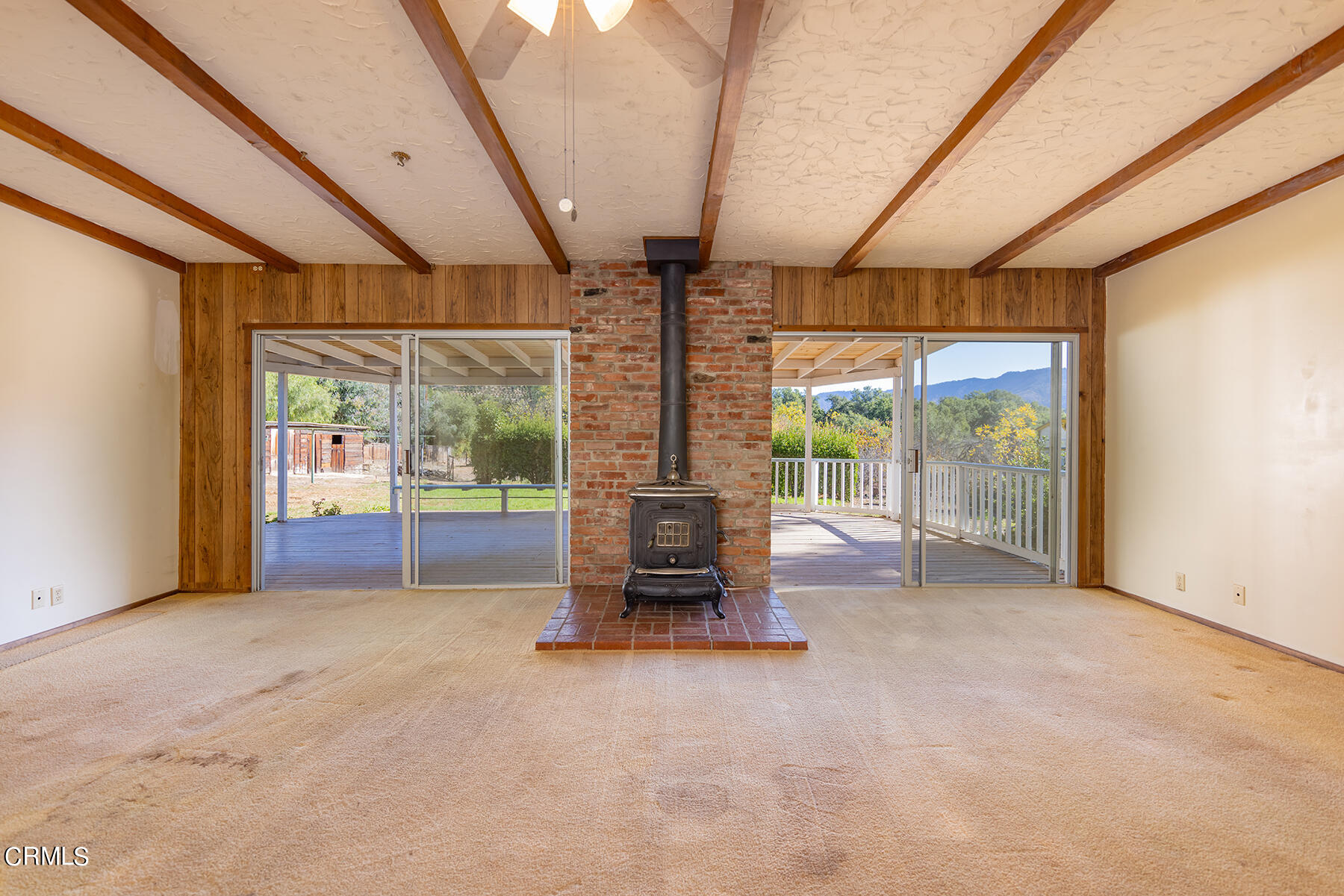 Undisclosed Address Ojai, CA 93023 - Photo 8 of 20 an empty room with floor to ceiling window and an outdoor view