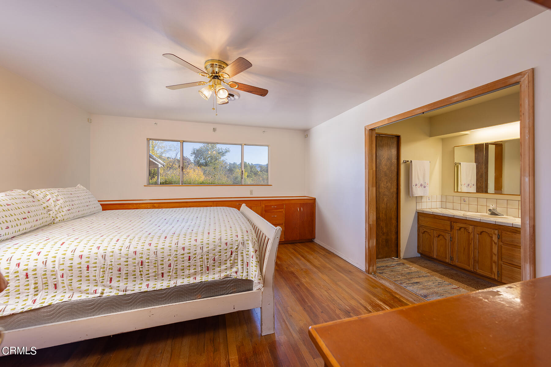 Undisclosed Address Ojai, CA 93023 - Photo 10 of 20 a bedroom with a bed and a chandelier