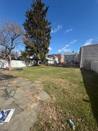 a view of a water fountain and a big yard