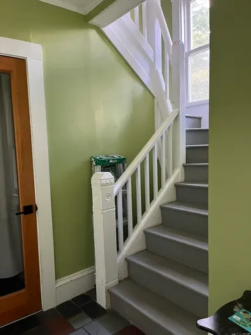 a room with a chair and wooden floor