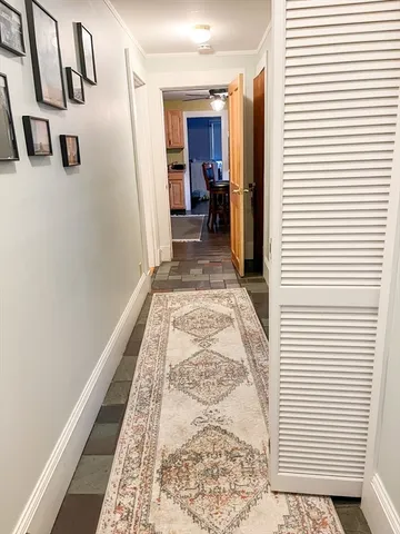 a view of a bedroom with wooden floor