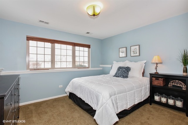 2809 Blakely Lane Naperville, IL 60540 - Photo 12 of 15 a bedroom with a bed and a window