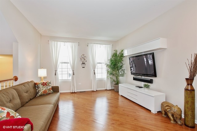 2809 Blakely Lane Naperville, IL 60540 - Photo 2 of 15 a living room with furniture and a flat screen tv