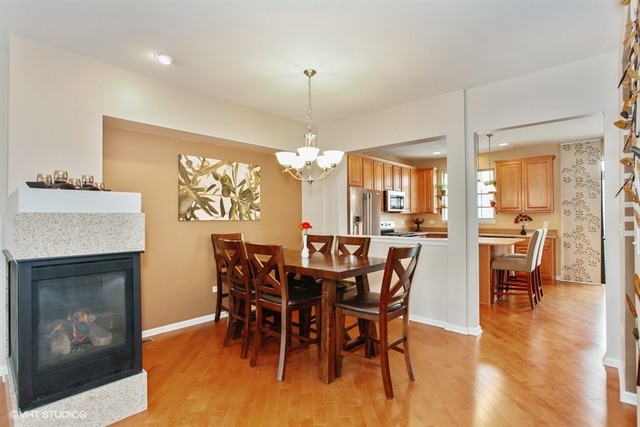 2809 Blakely Lane Naperville, IL 60540 - Photo 6 of 15 a view of a dining room with furniture window and wooden floor