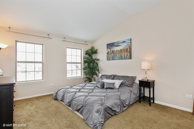 2809 Blakely Lane Naperville, IL 60540 - Photo 8 of 15 a bedroom with a bed and a window