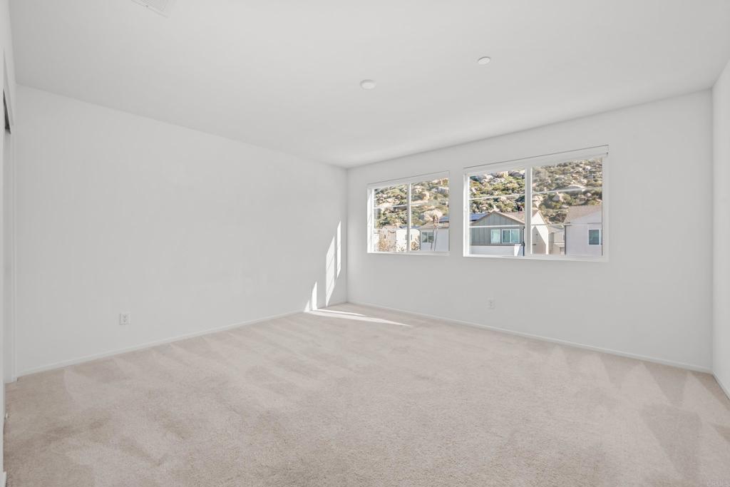 34742 Criollo Way Fallbrook, CA 92028 - Photo 13 of 28 an empty room with windows
