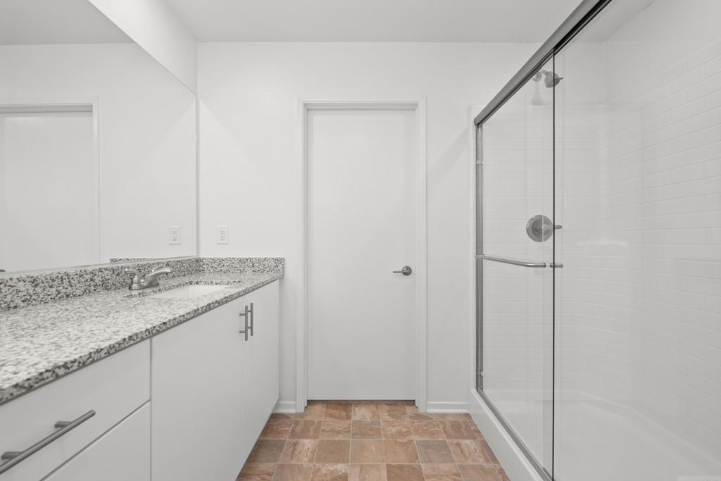 34742 Criollo Way Fallbrook, CA 92028 - Photo 20 of 28 a bathroom with a granite countertop sink and vanity