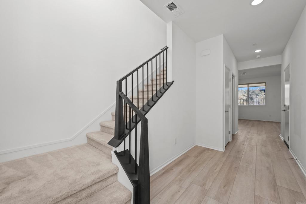 34742 Criollo Way Fallbrook, CA 92028 - Photo 2 of 28 a view of a hallway with wooden floor and entryway
