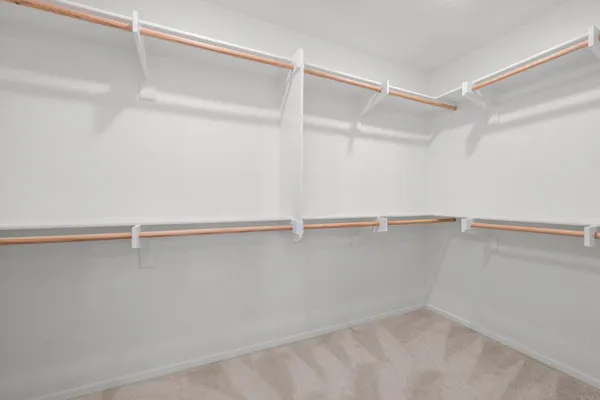 a view of an empty walk in closet
