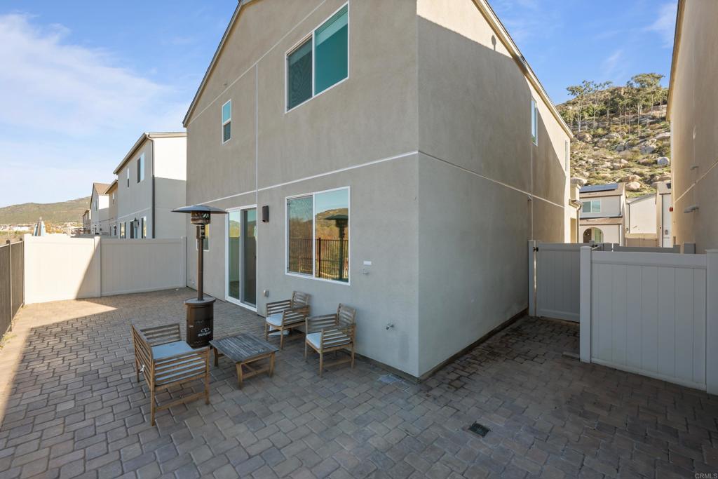 34742 Criollo Way Fallbrook, CA 92028 - Photo 23 of 28 a backyard of a house with outdoor seating