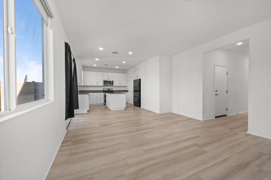 34742 Criollo Way Fallbrook, CA 92028 - Photo 7 of 28 a view of a kitchen with a sink and a refrigerator