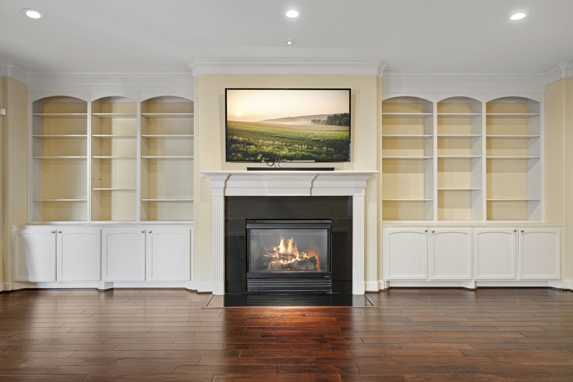 6310 Hermann Lake Drive Houston, TX 77021 - Photo 4 of 39 The living room features custom built-in cabinets, beautiful fireplace, and hardwood floors make this home feel cozy and inviting.