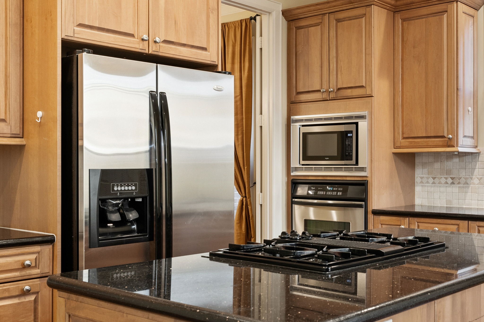 6310 Hermann Lake Drive Houston, TX 77021 - Photo 8 of 39 Granite countertops and stainless steel appliances.