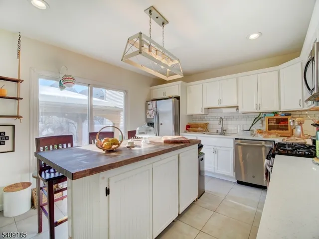 a kitchen with sink cabinets and window