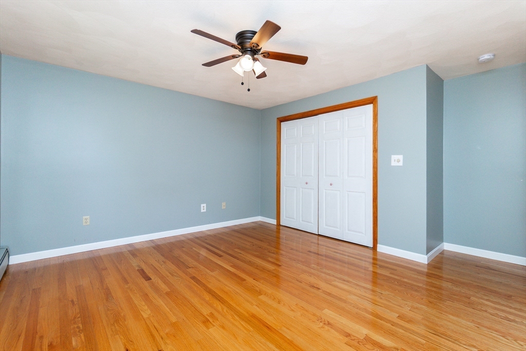 63 Bow Street Saugus, MA 01906 - Photo 19 of 42 wooden floor in an empty room with a window