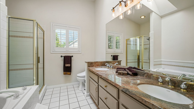 11128 South Barrett Pk Circle Sandy, UT 84092 - Photo 17 of 36 Double vanity with stone countertop, dual sinks, and gold-tone fixtures