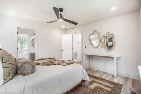 a bathroom with a toilet a sink and a mirror