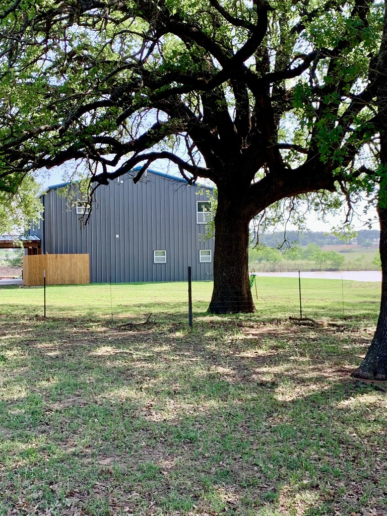 646 Victor Eckhardt Road Fredericksburg, TX 78624 - Photo 11 of 40 a view of a yard with wooden fence