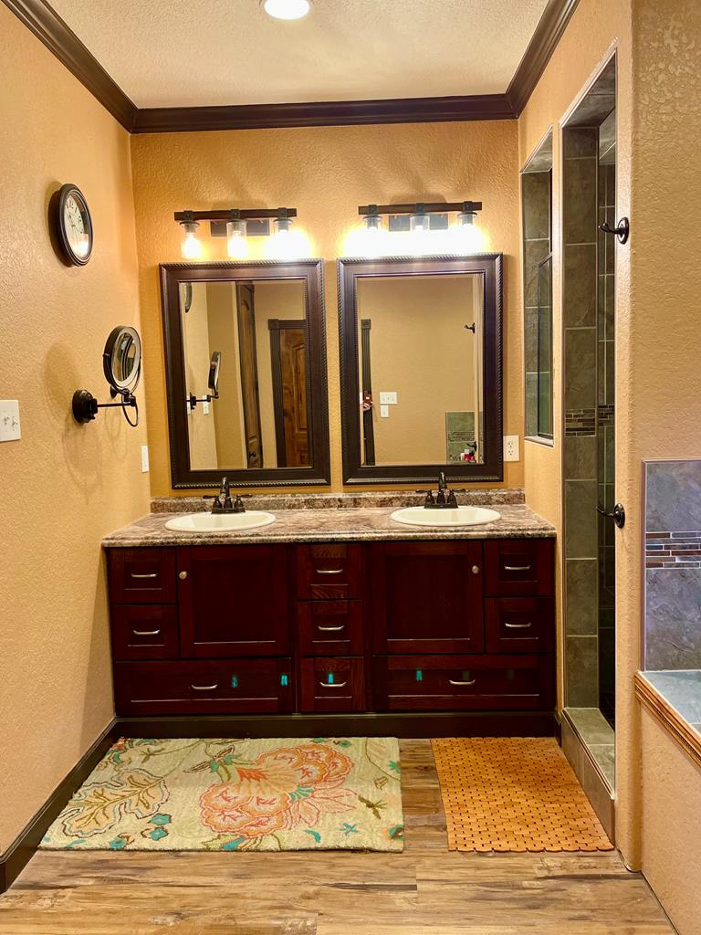 646 Victor Eckhardt Road Fredericksburg, TX 78624 - Photo 25 of 40 a bathroom with a sink and a mirror