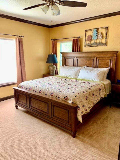 646 Victor Eckhardt Road Fredericksburg, TX 78624 - Photo 30 of 40 a bedroom with a bed and painting on the wall