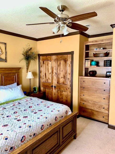 646 Victor Eckhardt Road Fredericksburg, TX 78624 - Photo 31 of 40 a bedroom with a bed a large mirror and furniture