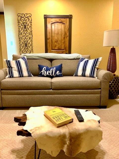 646 Victor Eckhardt Road Fredericksburg, TX 78624 - Photo 32 of 40 a living room with a couch and a lamp