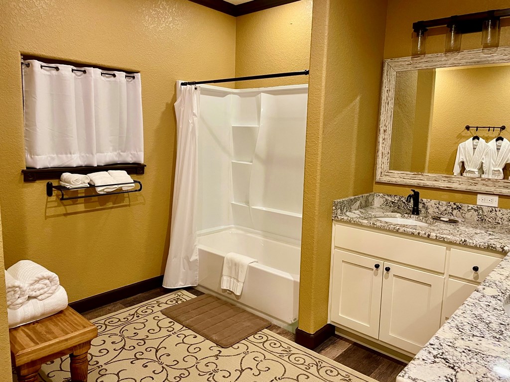 646 Victor Eckhardt Road Fredericksburg, TX 78624 - Photo 35 of 40 a bathroom with a sink and a mirror