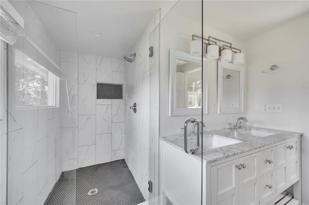 3940 Forrest Court Chamblee, GA 30341 - Photo 17 of 35 a bathroom with a granite countertop sink mirror and double