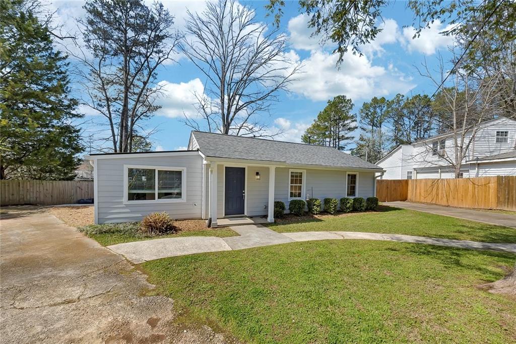 3940 Forrest Court Chamblee, GA 30341 - Photo 2 of 35 a front view of house with yard and trees