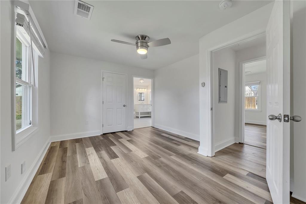 3940 Forrest Court Chamblee, GA 30341 - Photo 23 of 35 wooden floor in an empty room with a window