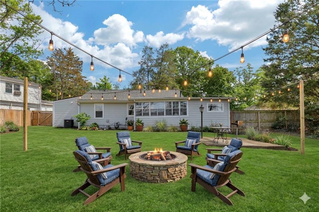 3940 Forrest Court Chamblee, GA 30341 - Photo 28 of 35 a backyard of a house with table and chairs