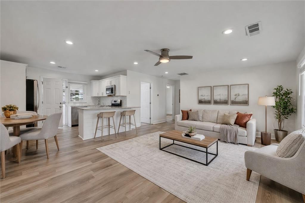 3940 Forrest Court Chamblee, GA 30341 - Photo 6 of 35 a living room with furniture and kitchen view
