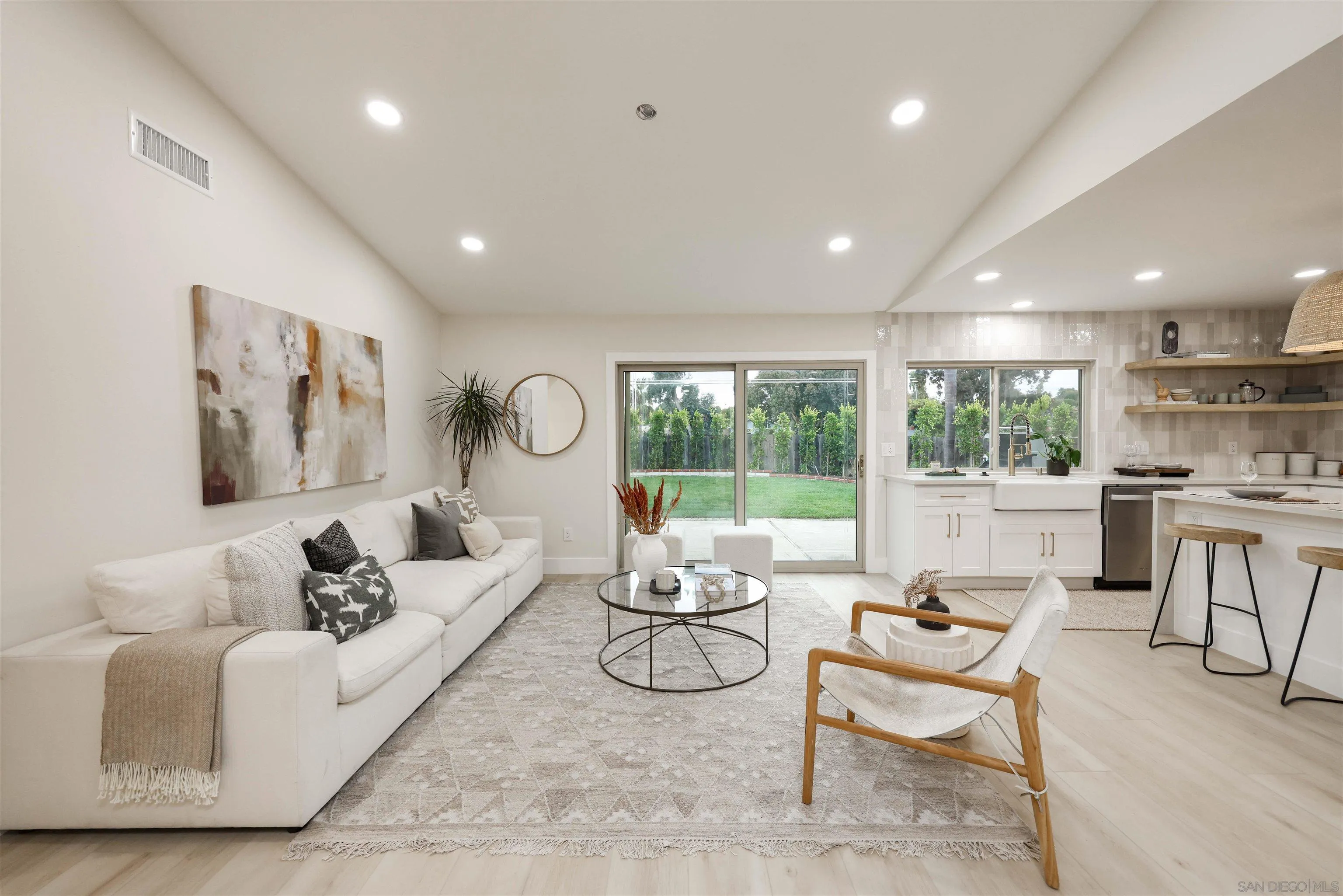 837 Elmview Drive Encinitas, CA 92024 - Photo 13 of 27 a living room with furniture and a large window