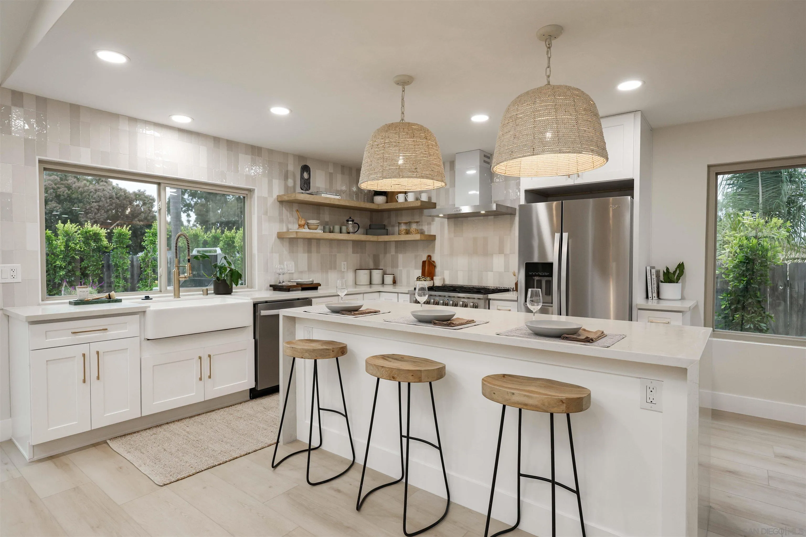 837 Elmview Drive Encinitas, CA 92024 - Photo 15 of 27 a kitchen with kitchen island granite countertop a sink and a stove top oven