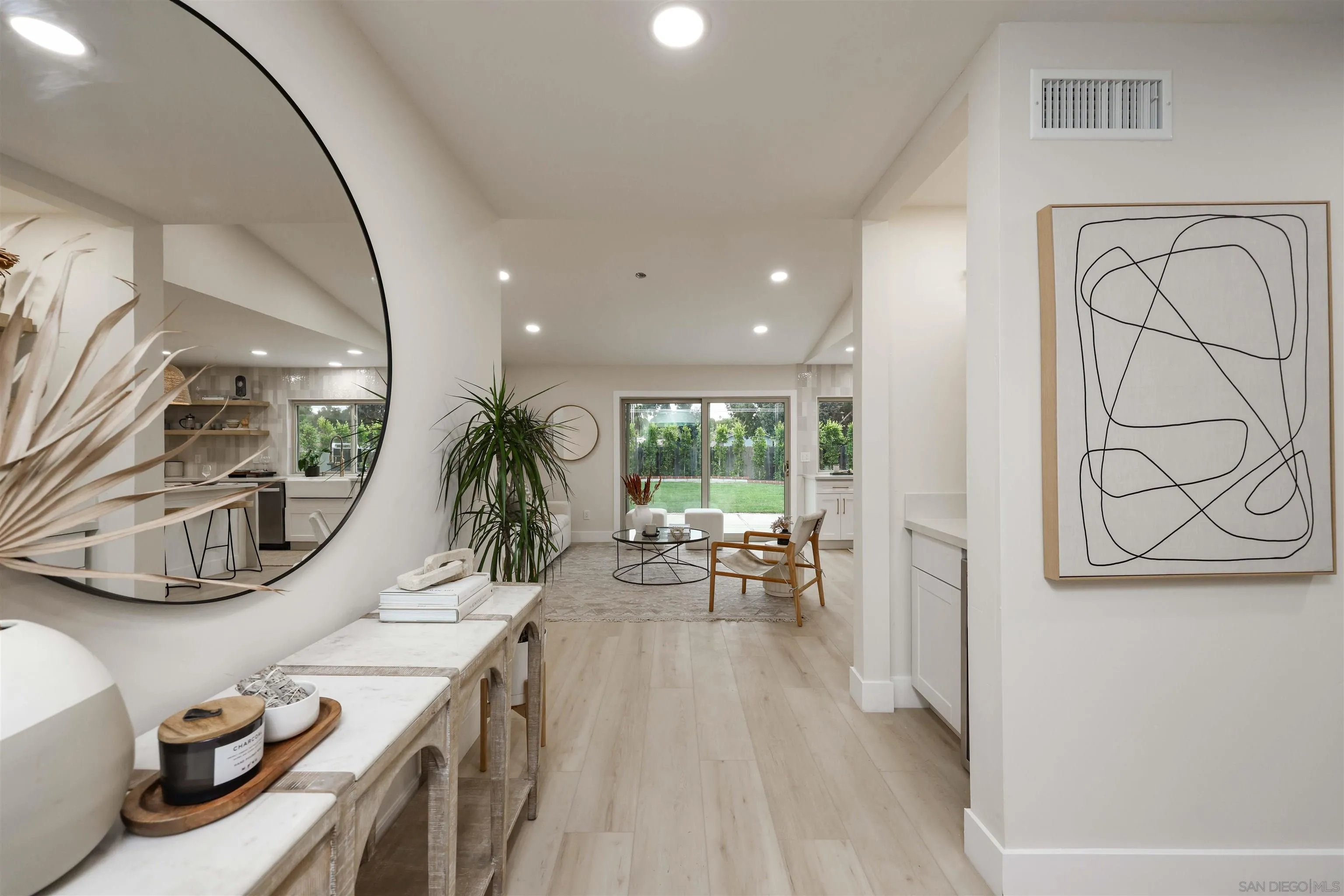 837 Elmview Drive Encinitas, CA 92024 - Photo 3 of 27 a very nice looking room with wooden floor and furniture