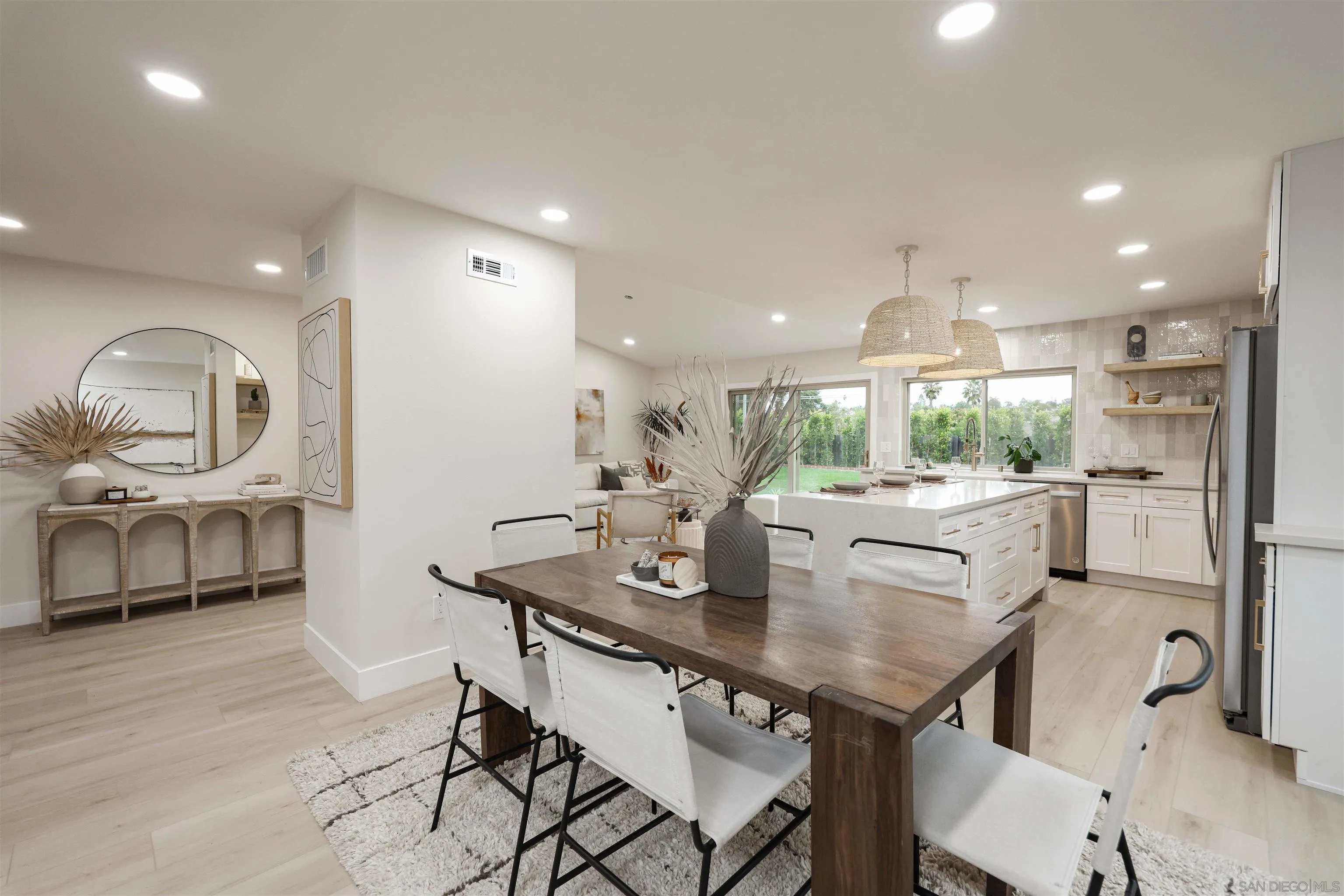 837 Elmview Drive Encinitas, CA 92024 - Photo 9 of 27 a kitchen with stainless steel appliances kitchen island granite countertop a sink and cabinets