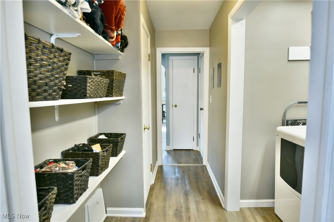 600 Prentice Road Northwest Warren, OH 44481 - Photo 25 of 47 Hallway with wood-style flooring and washer / clothes dryer