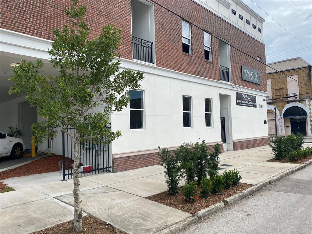 2004 North Howard Avenue, Unit 204 Tampa, FL 33607 - Photo 1 of 1 a view of a house with a yard and plants