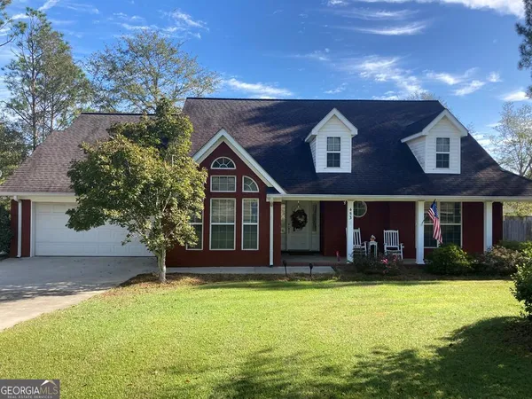 front view of a house with a yard