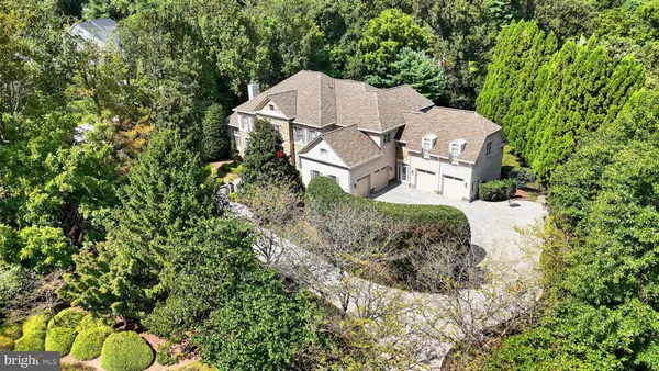 a view of a deck with furniture and garden