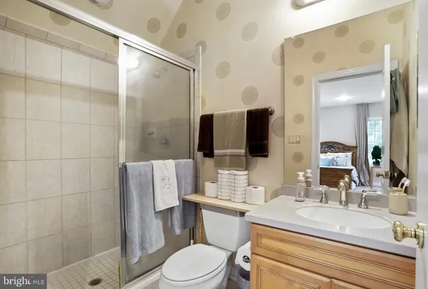 a living room with furniture and floor to ceiling windows