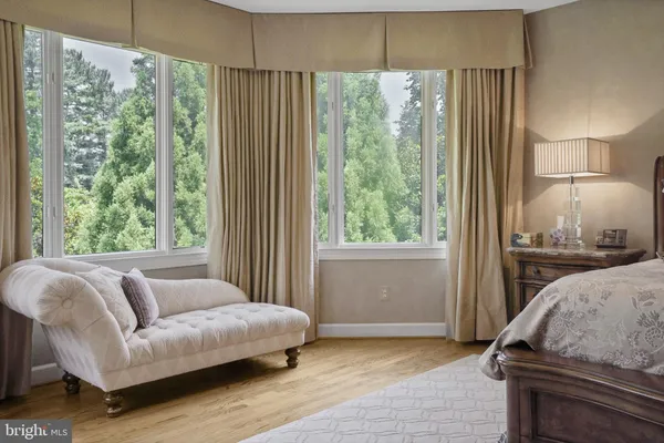 a view of a dining room with furniture and a chandelier