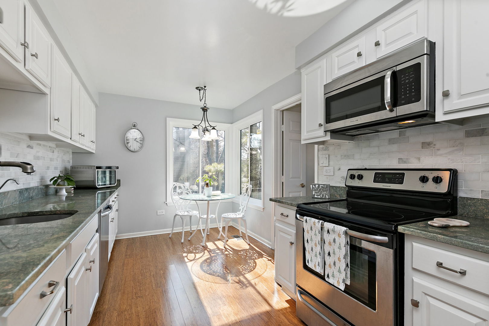 260 Timber Ridge Lane, Unit A Lake Barrington, IL 60010 - Photo 11 of 34 a kitchen with a stove and a microwave