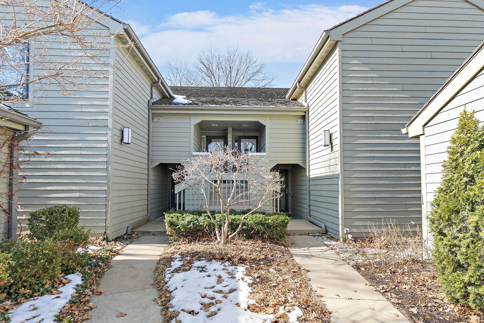 260 Timber Ridge Lane, Unit A Lake Barrington, IL 60010 - Photo 2 of 34 a front view of a house with garden