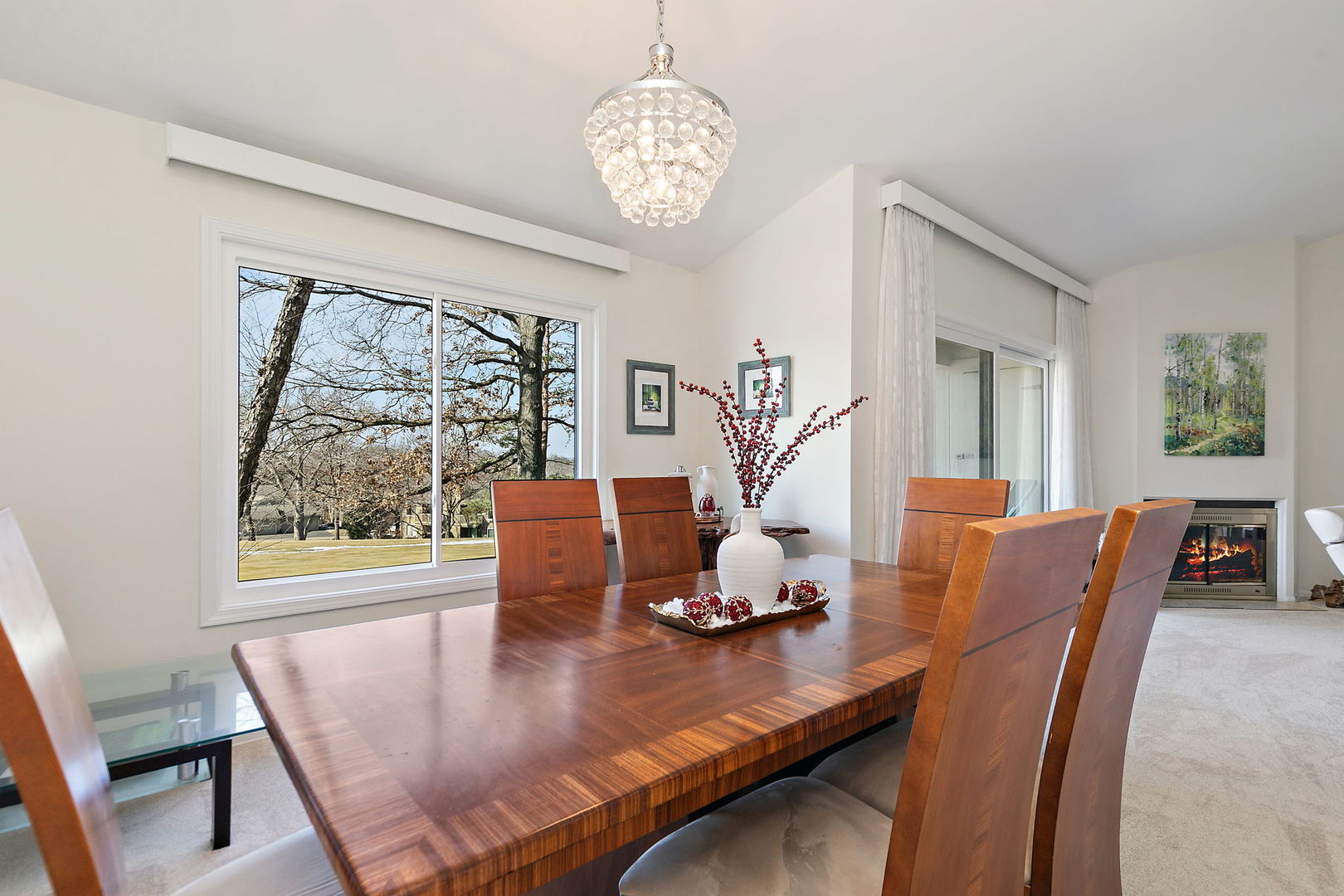 260 Timber Ridge Lane, Unit A Lake Barrington, IL 60010 - Photo 9 of 34 a view of a dining room with furniture a chandelier and wooden floor